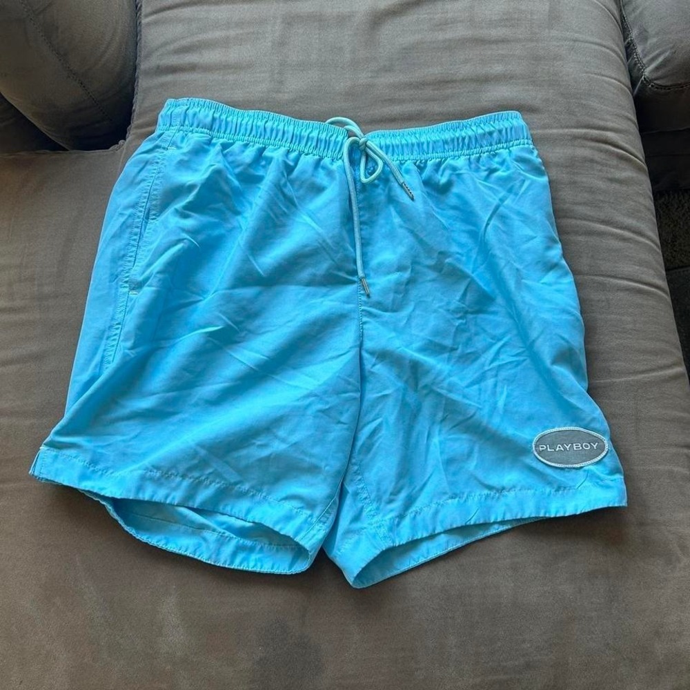Blue Playboy swim trunks